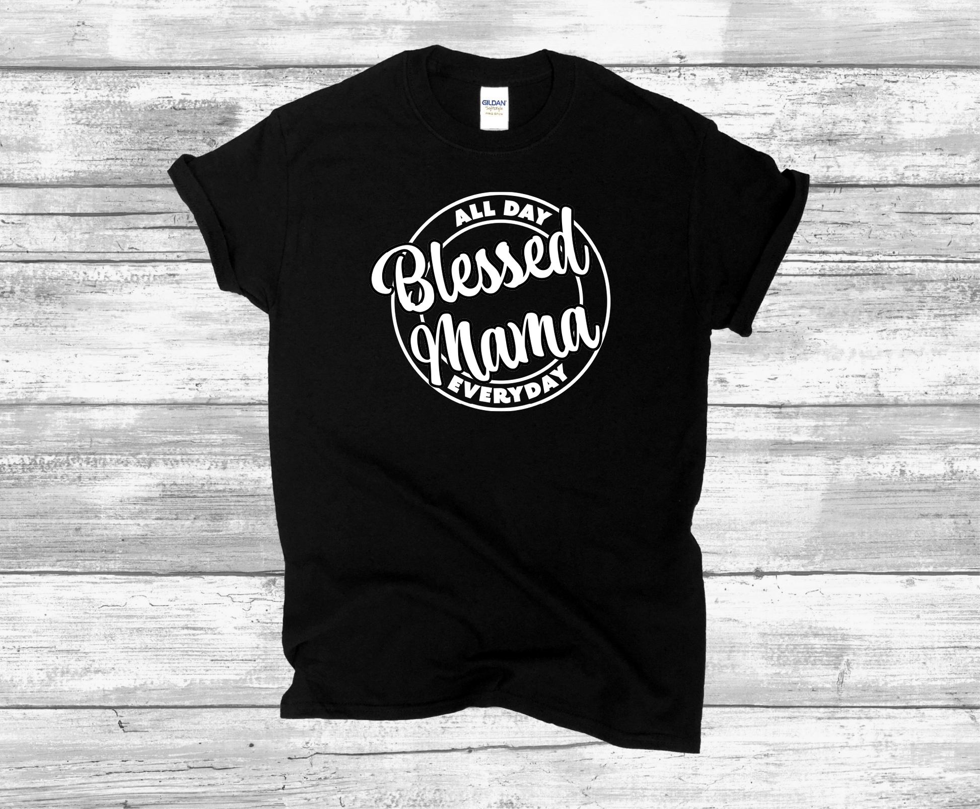 Black t-shirt printed with a design with the words Blessed Mama All Day Everyday in white text.