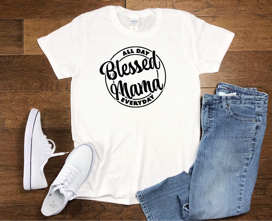 White t-shirt printed with the design with words Blessed Mama All Day Everyday in black text.